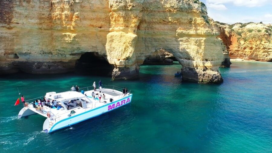 Albufeira: Catamaran Cruise with BBQ & Open Bar on the Beach - Benagil Caves Up Close: Where the Dinghy Part Matters
