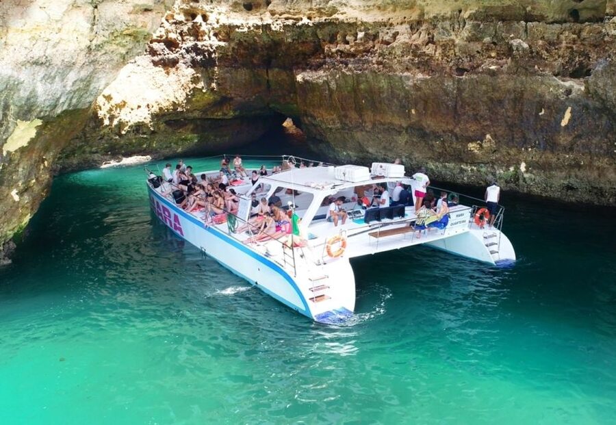 Albufeira: Caves and Coastline Catamaran Cruise to Benagil - Champagne toast and drinks you can buy: what happens on the way back