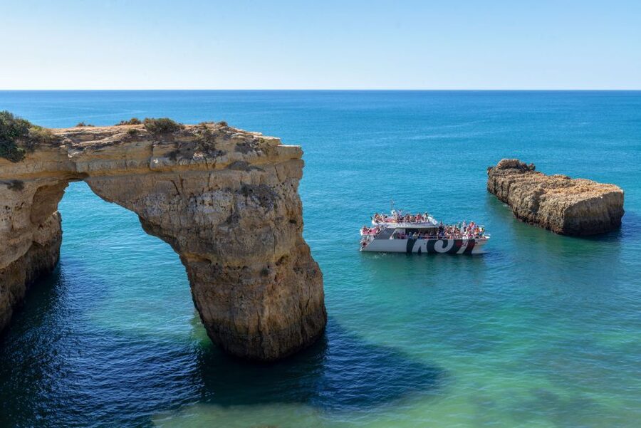 Algarve 3-Hour Caves and Coastline Boat Trip - A catamaran view that makes the Algarve cliffs feel bigger