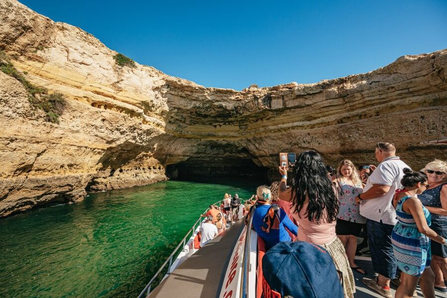 Algarve 3-Hour Caves and Coastline Boat Trip - Cruising the coast toward Carvoeiro: rock formations, narration, and short scenic stops