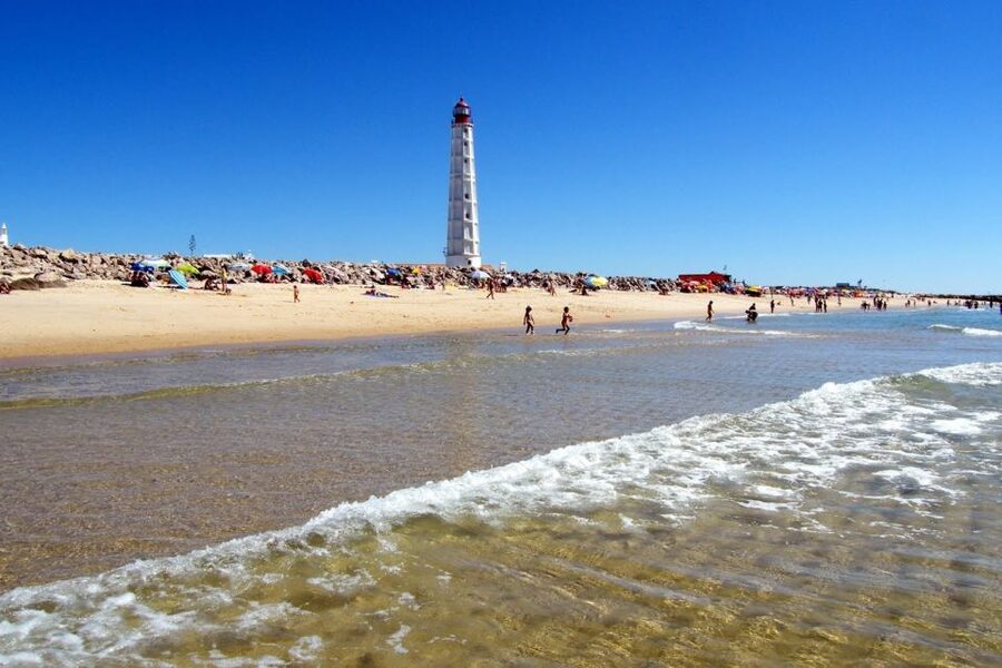 From Faro: 4 Stops, 3 Islands in Ria Formosa Catamaran Tour - Stop 2, Ilha do Farol: lighthouse photos and typical Algarve houses