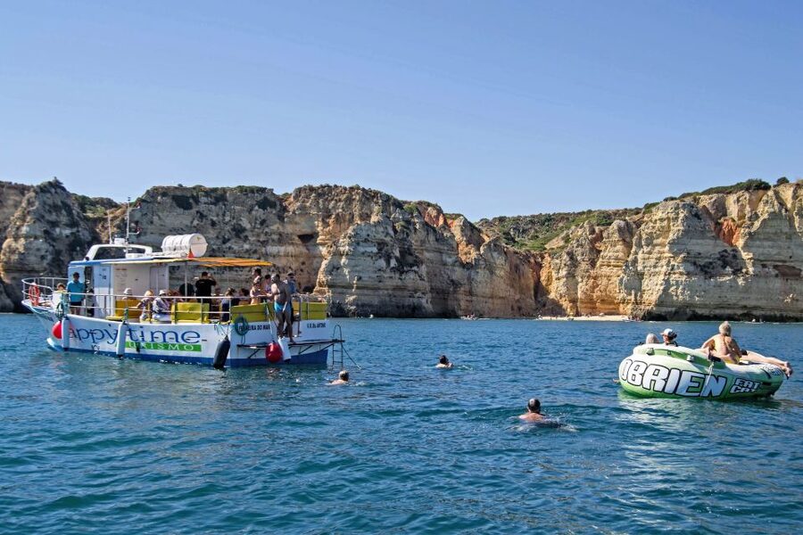 From Lagos: 2.5-Hour Guided Coastal Boat Tour & Grotto Visit - Swim stop and aqua trampoline time: fun, but plan around seasickness and time