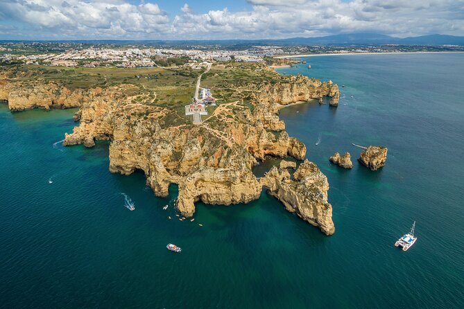 Lagos Half-Day Catamaran Cruise with Lunch - Stop One: Praia da Luz and the Iconic Black Rock