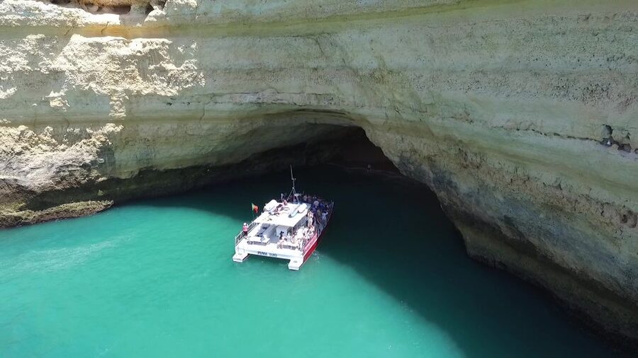 Quarteira: Benagil Cave Guided Catamaran Day Cruise & Drink - Vilamoura to Benagil: Why This Catamaran Works So Well