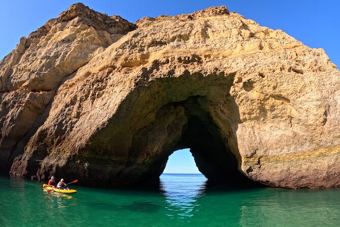 Sunrise Small Group Kayak Experience in BENAGIL Cave & 4K Photos - Carvalho Beach first: the carved-rock tunnel moment